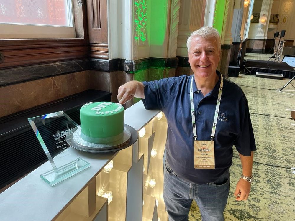 Jonathan Brownson, RPG, cuts the celebratory cake